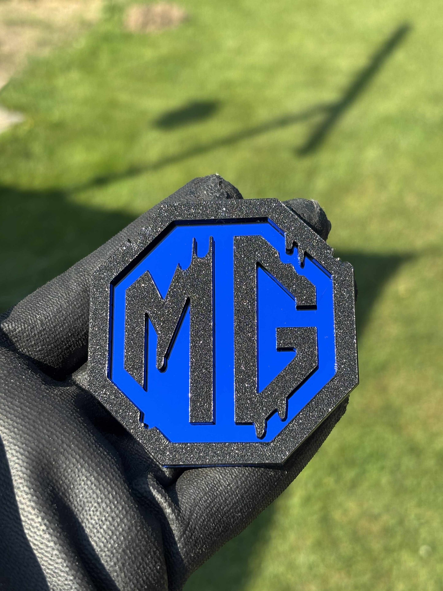 MG